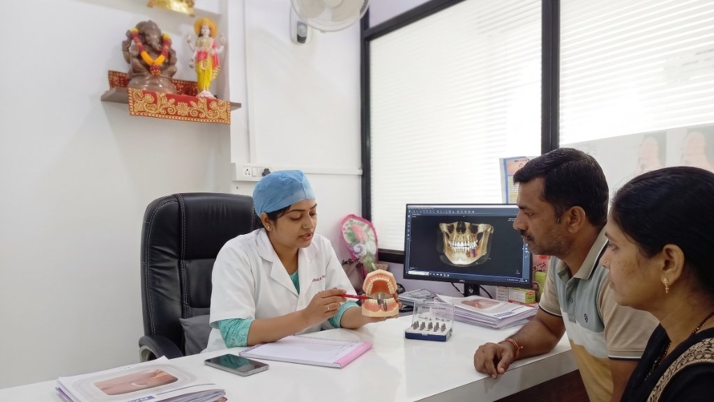 Dr. Sonali Aditya Yelikar consulting with patients at Sonali's Dental Clinic