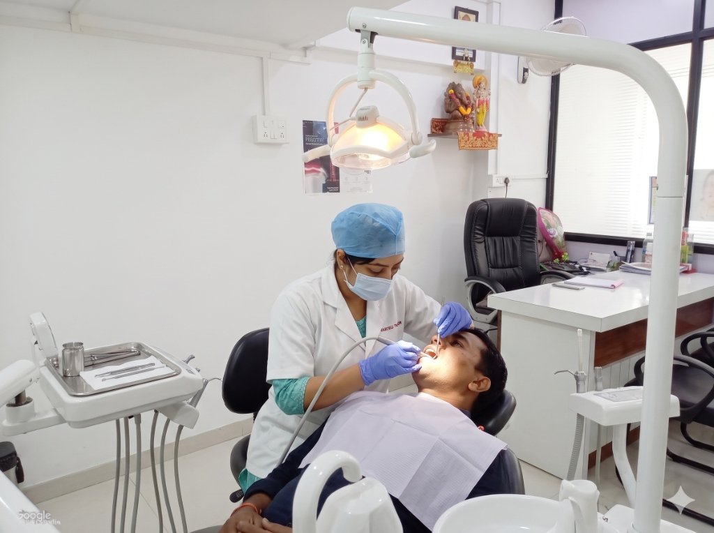 Dr. Sonali Aditya Yelikar treating a patient at Sonali's Dental Clinic